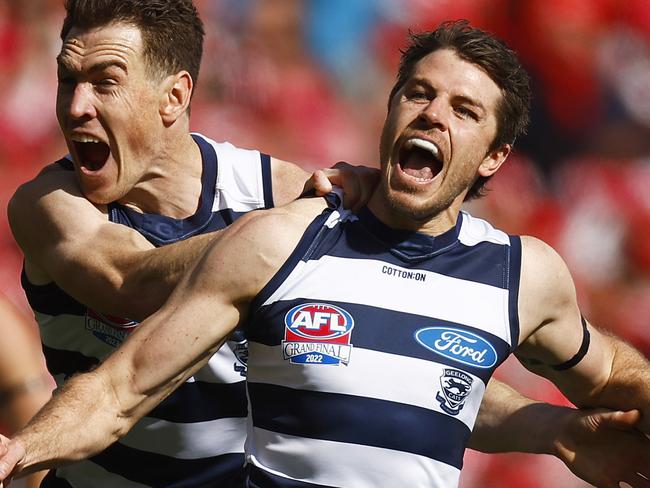 MELBOURNE, AUSTRALIA - SEPTEMBER 24: Isaac Smith of the Cats (R) celebrates kicking a goal along side Jeremy Cameron of the Cats during the 2022 AFL Grand Final match between the Geelong Cats and the Sydney Swans at the Melbourne Cricket Ground on September 24, 2022 in Melbourne, Australia. (Photo by Daniel Pockett/AFL Photos/via Getty Images)