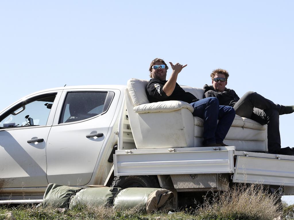 Tim Harper, 26, from Yacka and Mark Candy, 30, from Callington take in the action. Picture: SARAH REED