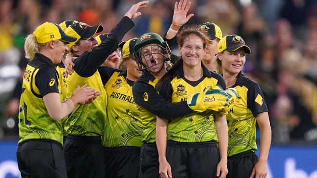 Megan Schutt of Australia celebrates with Alyssa Healy. AAP Image/Scott Barbour