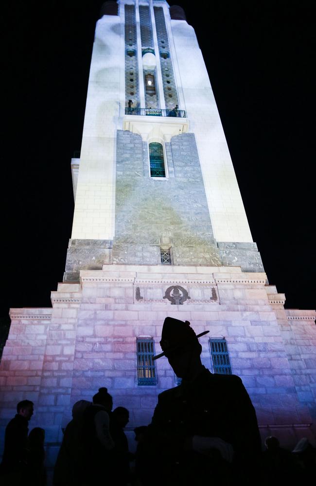 A soldier stands guard in front of the carillon during the dawn service at Pukeahu National War Memorial Park in Wellington, New Zealand. Picture: Hagen Hopkins/Getty Images