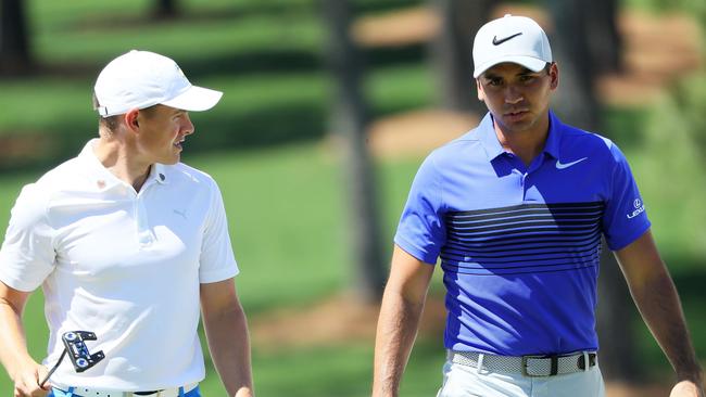 Jason Day chats with Englishman Scott Gregory during a Master practcie round.