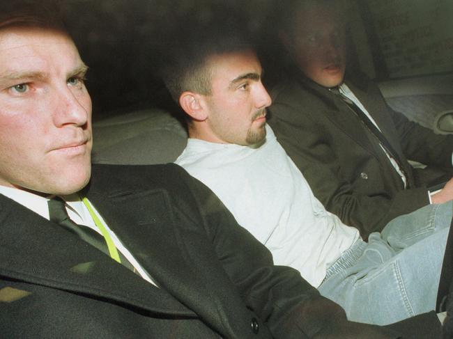 Jason Roberts is driven out of the St. Kilda Road Police Station after questioning in 2000.