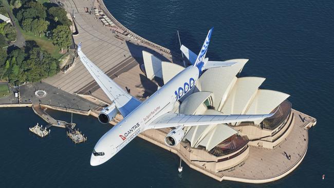 An Airbus A350-1000 flight test aircraft flies over the Sydney Opera House to mark the announcement by Qantas about non-stop 