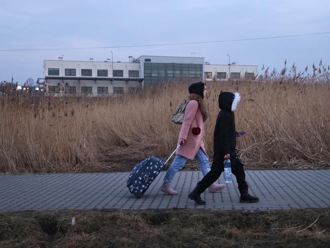 People arrive from war-torn Ukraine at the Medyka border crossing in Poland. Picture: Sean Gallup/Getty Images