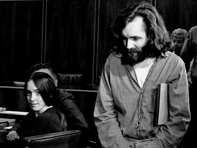 Charles Manson walks into court in 1970 as family “member” Susan Atkins looks on. Picture: AP