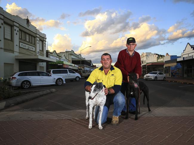 Coonamble's James Doolan with greyhound Lottie and Coonamble Greyhound Racing president Graham Pickering with Beryl. Picture: Dylan Robinson