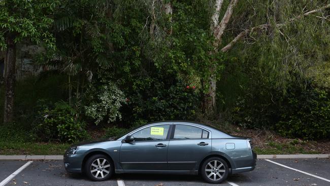 A stolen car is left abandoned in the beach carpark off Sims Esplanade at Yorkeys Knob. The boy facing the Supreme Court this week had 15 unlawful use of motor vehicle offences on his criminal history. PICTURE: BRENDAN RADKE