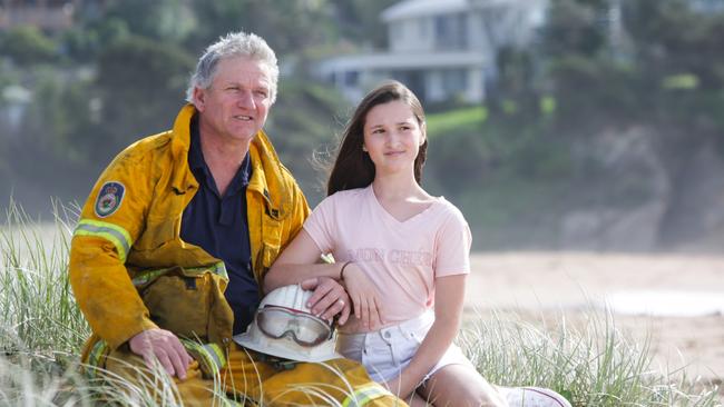 Malua Bay Brigade Rural Fire Service member Steve Hillyar with his daughter Ellie. Picture Liam Driver