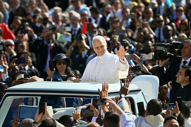 Pope Leo XIV greets the crowd from the popemobile before a Holy mass for the beginning of his pontificate