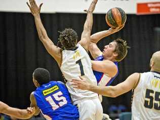 IN THE LANE: Mountaineers guard Jason Ebneter shoots in traffic during his side's match agains the Logan City Thunder. Picture: Nev Madsen