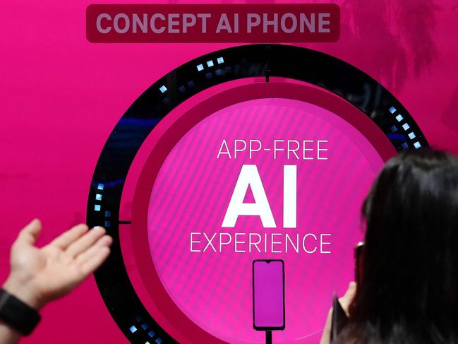 An Ai (artificial intelligence) sign is seen on Deutsche Telekom AG's stand at the Mobile World Congress (MWC), the telecom industry's biggest annual gathering, in Barcelona on February 27, 2024. The world's biggest mobile phone fair throws open its doors in Barcelona with the sector looking to artificial intelligence to try and reverse declining sales. (Photo by PAU BARRENA / AFP)