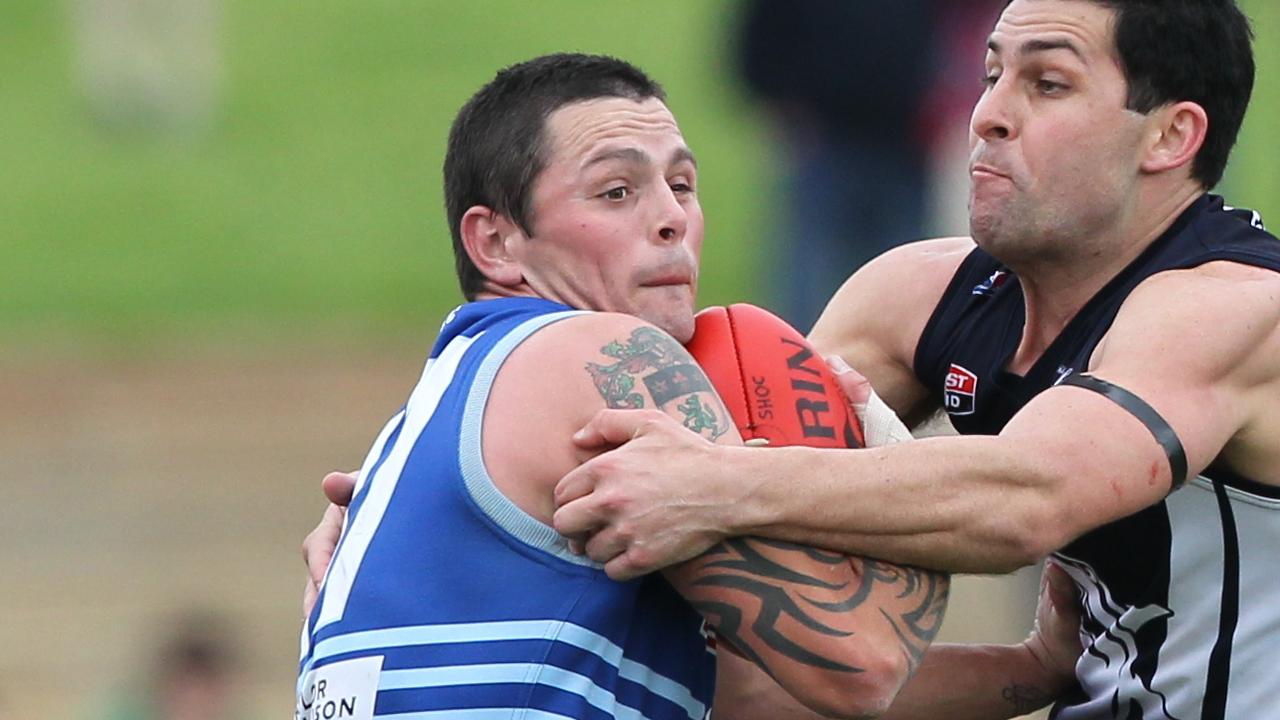 SAAFL football - Henley vs Sacred Heart Old Collegians grand final match at Thebarton Oval. Jed Wilson (left) tackled by Jason Turner.