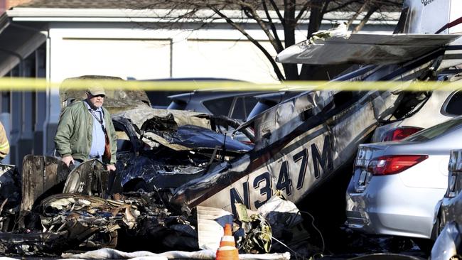 First responders work the scene after a plane crashed in a parking lot of a retirement community Sunday, March 9, 2025, in Manheim Township, Pa. (Zach Gleiter/The Patriot-News via AP)