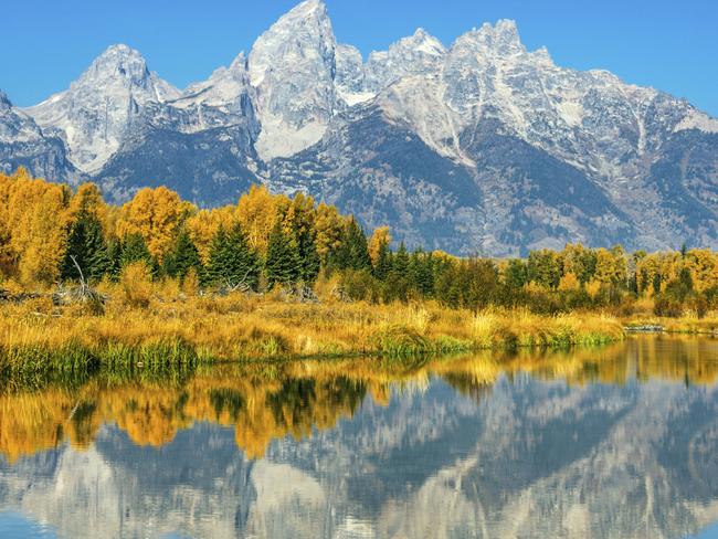 ESCAPE: YELLOWSTONE NATIONAL PARK .. Andy Smeerdijk story .. . Looking across Jackson Lake towards the Teton Range, Grand Teton National Park, near Yellowstone National Park. Picture: iStock