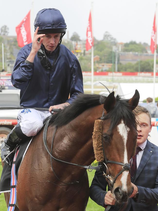 Moore salutes the crowd as he returns to scale. Pic: Getty Images