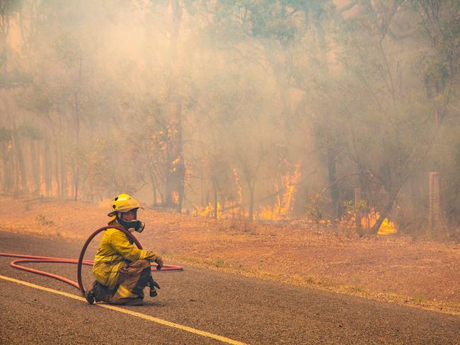 Firefighters working to control a bushfire in Deepwater, Central Queensland. Picture: AAP Image/QFES Media