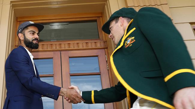 India captain Virat Kohli greets his Australian counterpart Tim Paine yesterday