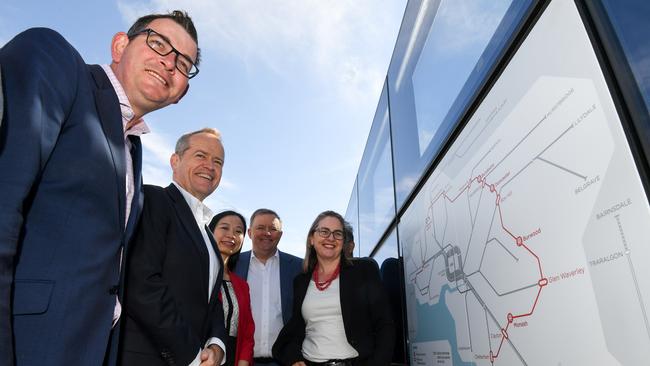 Premier Daniel Andrews (left) inspects plans for the suburban rail loop.