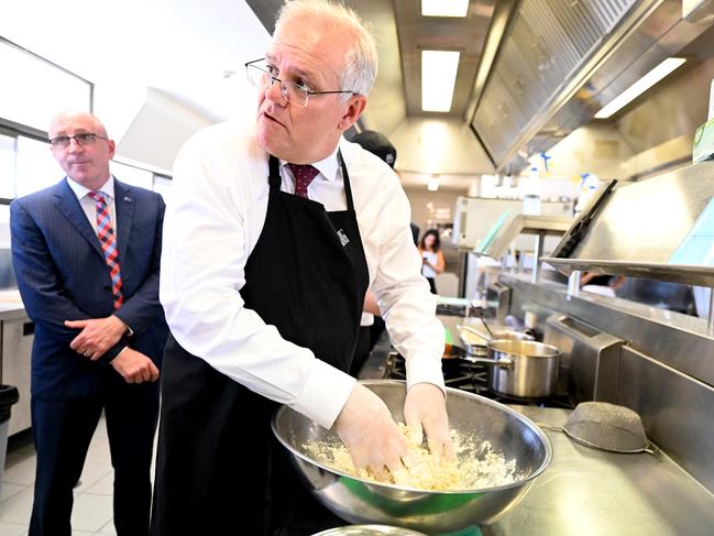 BRISBANE, AUSTRALIA - NewsWire Photos - MARCH 21, 2022.Prime Minister Scott Morrison mixes pasta dough as he visits the Australian Trade College in Scarborough, north of Brisbane.Picture: NCA NewsWire / Dan Peled