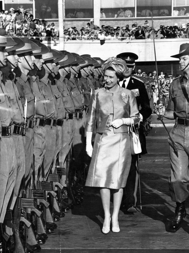 The Queen inspecting a guard of honour after her arrival at Adelaide Airport in 1963.