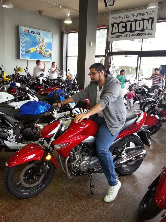 Richard Sharobeem on a motorcycle his mother allegedly purchased using not-for-profit funds.