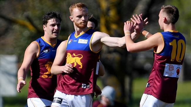 Jake Potter celebrates a goal with South Morang teammates. Picture: Andy Brownbill