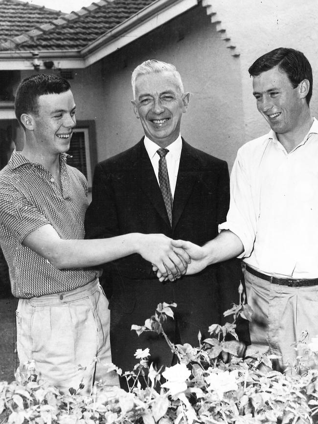 North Melbourne Football Club president Jack Adams being congratulated by his sons, Denis, 17, and John, 20 when he was appointed in 1961.