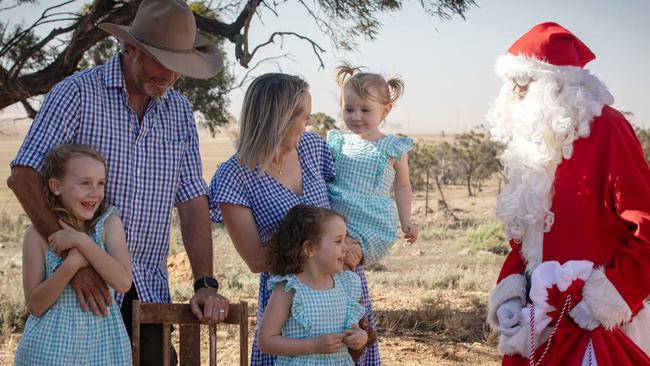 ADELAIDE, SOUTH AUSTRALIA - Advertiser Photos DECEMBER 22, 2024: Santa visits Grain Farmer Andrew Walker and his family wife and children Elsie 7yrs, Callie 5yrs and Lucy 3yrs at their Booleroo Centre property, SA. Picture: Emma Brasier