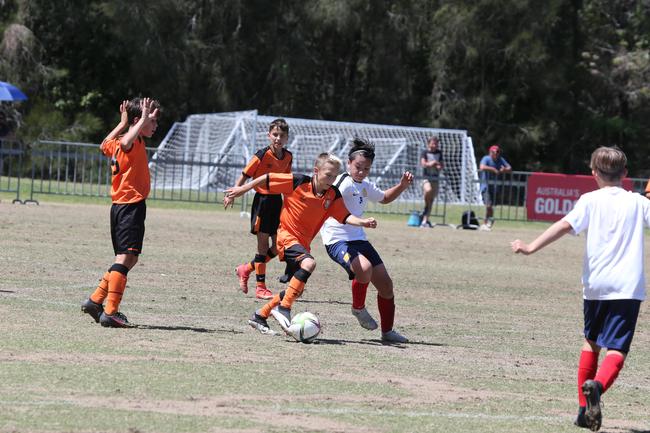 The Premier Invitational football tournament on the Gold Coast. Brisbane Roar Orange v TFC Brisbane White under-13s in action. Picture: Mike Batterham.