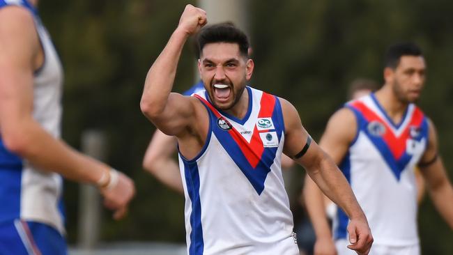 West Preston Lakeside midfielder Ozgur Uysal kicks the goal to seal his team's win over Macleod in the Northern Football League. Picture: Nathan McNeill.