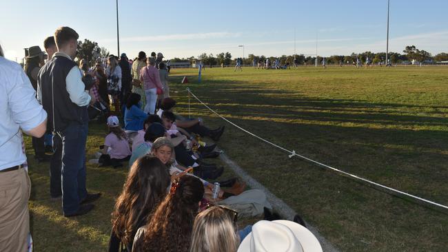Spectators cheer on as they watch the A Grade Roma vs Condamine match at the Roma Rugby Races at Bassett Park. Picture: Chloe Cufflin.