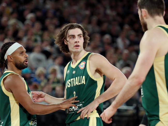 Patty Mills and Josh Giddey during a game against Brazil at Rod Laver Arena. Picture: Kelly Defina/Getty Images