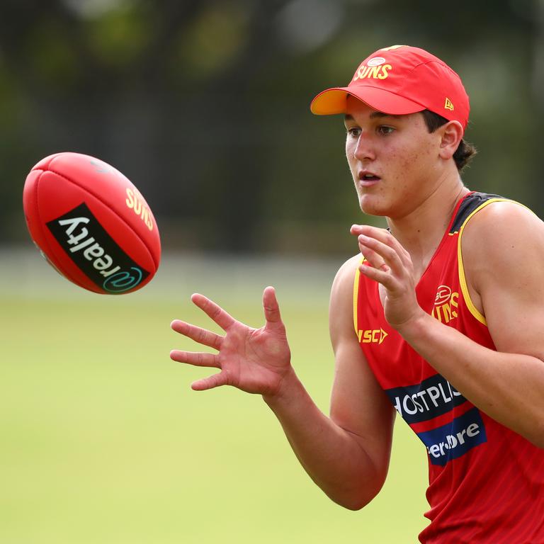 Wil Powell handballs during a Gold Coast Suns AFL media and training session at Metricon Stadium on November 04, 2019 in Gold Coast, Australia. (Photo by Chris Hyde/Getty Images)