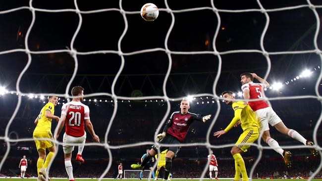 Arsenal defender Sokratis, right, heads home his side’s third goal against Bate Borisov in their Europa League match at Emirates Stadium. Picture: Getty Images