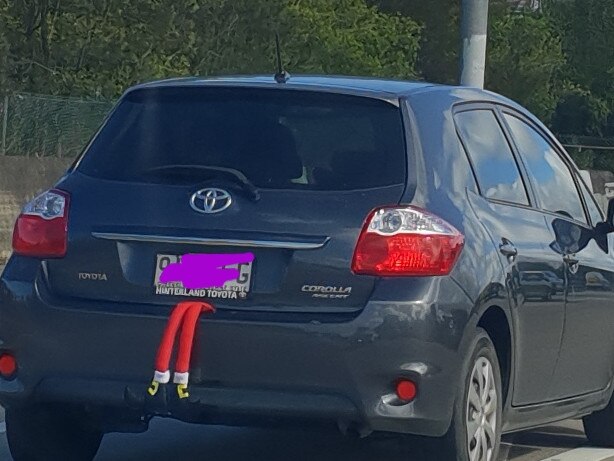 Amusing decoration on the back of a car, seen between Brisbane and the Gold Coast, December 2018.