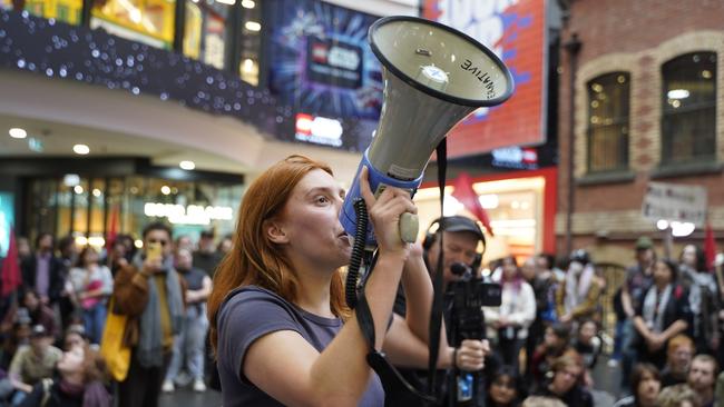 Jasmine Duff surrounded by protesters at the major shopping centre. Picture: Valeriu Campan