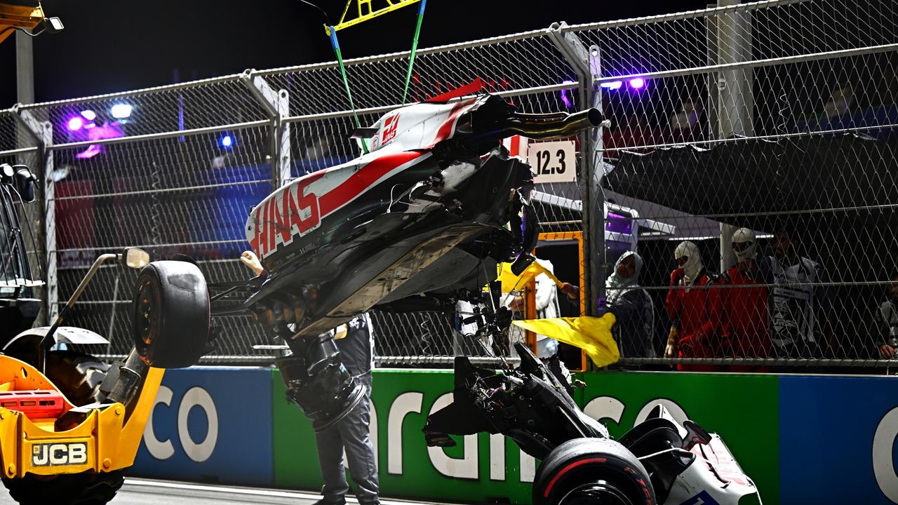 JEDDAH, SAUDI ARABIA - MARCH 26: The car of Mick Schumacher of Germany and Haas F1 is removed from the track following a crash during qualifying ahead of the F1 Grand Prix of Saudi Arabia at the Jeddah Corniche Circuit on March 26, 2022 in Jeddah, Saudi Arabia. (Photo by Clive Mason/Getty Images)