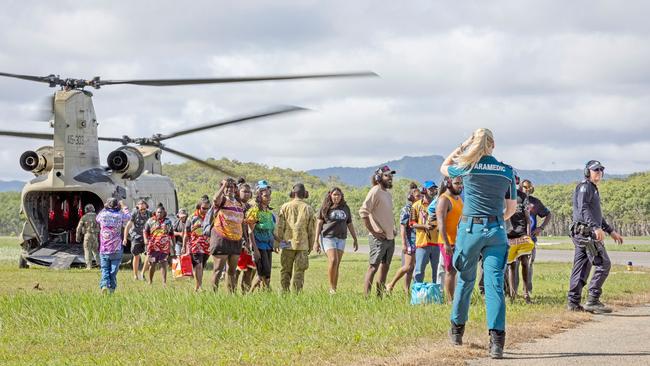 Australian Army personnel from the 5th Aviation Regiment, Queensland Police and Emergency Services assist residents to evacuate from Wujal Wujal to Cooktown via CH-47F Chinook helicopter, on December 21, 2023. Tropical Cyclone Jasper