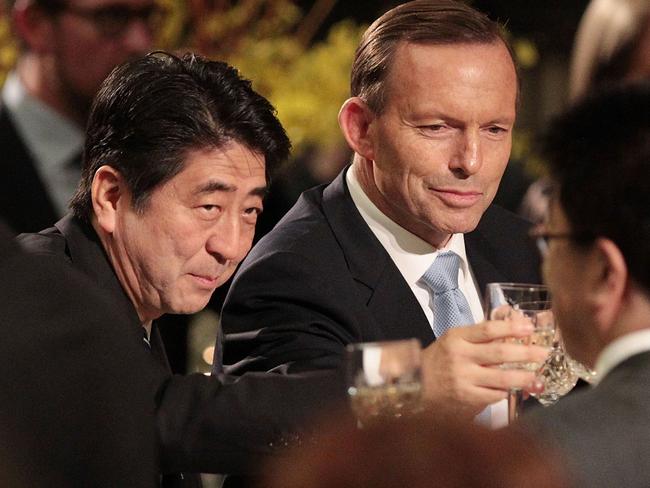 The carbon tax wasn’t abolished today, but Mr Abbott got the opportunity to chum it up with Japan’s Prime Minister Shinzo Abe. Picture: Getty Images