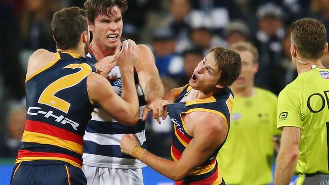 Brad (left) and Matt Crouch come to grips with Geelong’s Tom Hawkins. Picture: MICHAEL DODGE (Getty Images).