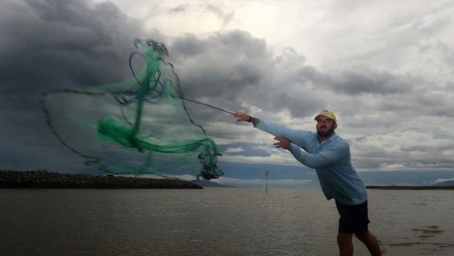 Steven Bowden cast his net in the turning tide near Townsville Port for a prawn sandwich for tea. Picture: Evan Morgan