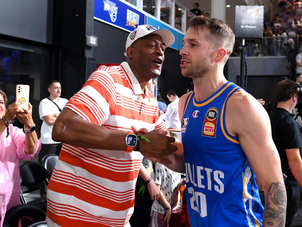 Nathan Sobey celebrates victory with former player Leroy Loggins after the round five NBL match between Brisbane Bullets and the Jackjumpers. Picture: Getty Images