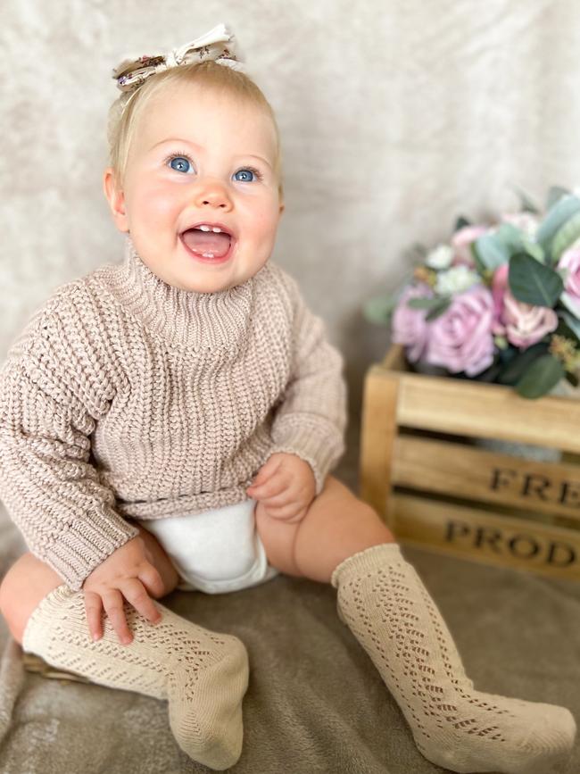 Mrs Watts’ daughter Everly Watts dressed in some of her mum's clothing label Everly Lane including the Sunchaser Knit Jumper and Adeline Socks.