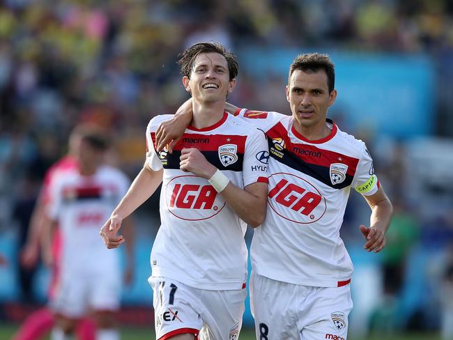 GOSFORD, AUSTRALIA - NOVEMBER 04:  Craig Goodwin and Isaias of Adelaide celebrate a goal during the round three A-League match between the Central Coast Mariners and Adelaide United at Central Coast Stadium on November 4, 2018 in Gosford, Australia.  (Photo by Tony Feder/Getty Images)