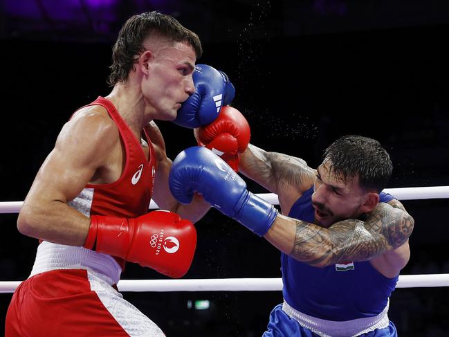 Harry Garside cops a right to the face from Hungary’s Richard Kovacs in his first round loss in Paris. Picture: Michael Klein