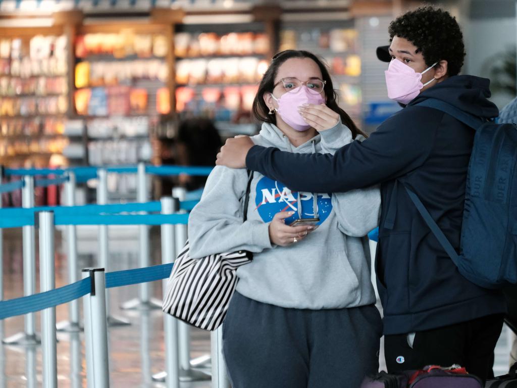 Travellers wearing masks at New York’s John F. Kennedy Airport. The mask mandate for US airports has been dropped as new Covid variants are on the rise. Picture: Getty