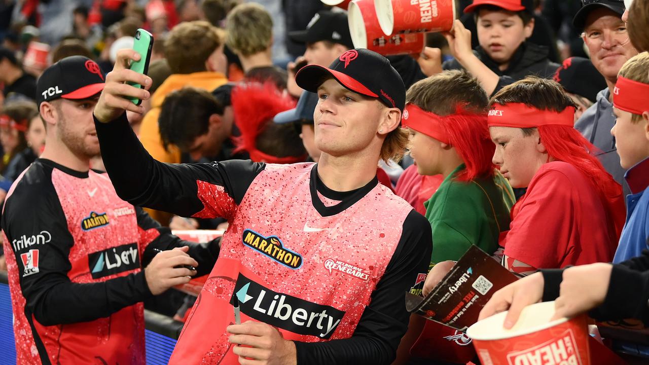 Jake Fraser-McGurk of the Renegades poses for selfies with fans after the match was called off. (Photo by Quinn Rooney/Getty Images)