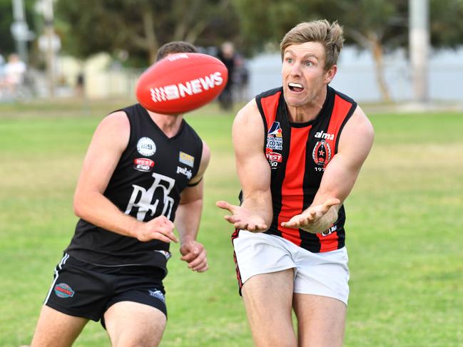 AMATEUR FOOTY: Port District (black) v Rostrevor Old Collegians (red) photograph at Largs Bay, Adelaide on Saturday the 26th of May 2018. R - Michael Coad(AAP/ Keryn Stevens)