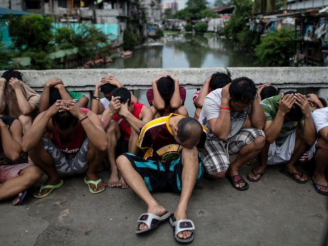 Drug suspects are rounded up during an anti-illegal drugs operation at an informal settlers’ community at the Manila Islamic Center in Manila on October 7, 2016. Picture: AFP Photo/Noel Celis