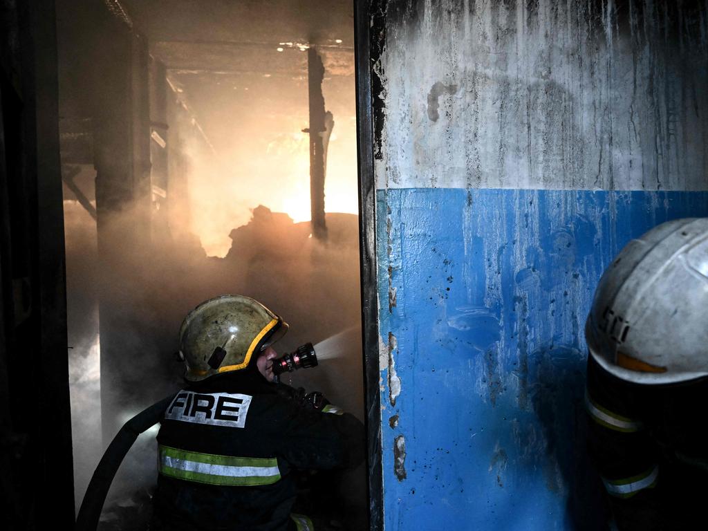 Firefighters work on a fire in a building after bombings on the eastern Ukraine town of Chuguiv. Picture: AFP